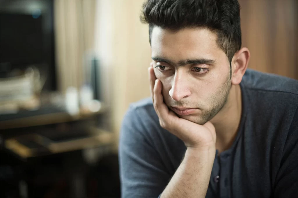 Mitochondrial Dysfunction and Mental Health Man experiencing low mood and fatigue associated with mitochondrial dysfunction and brain energy imbalance